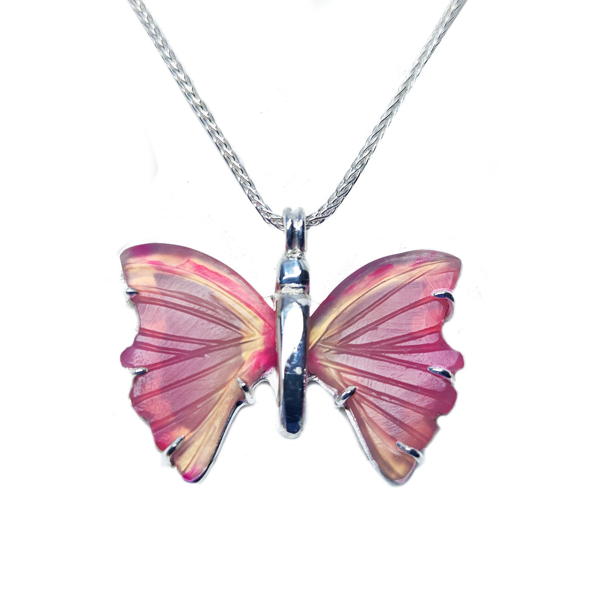 Agate butterfly-shaped pendant on a silver chain topside view against a white background