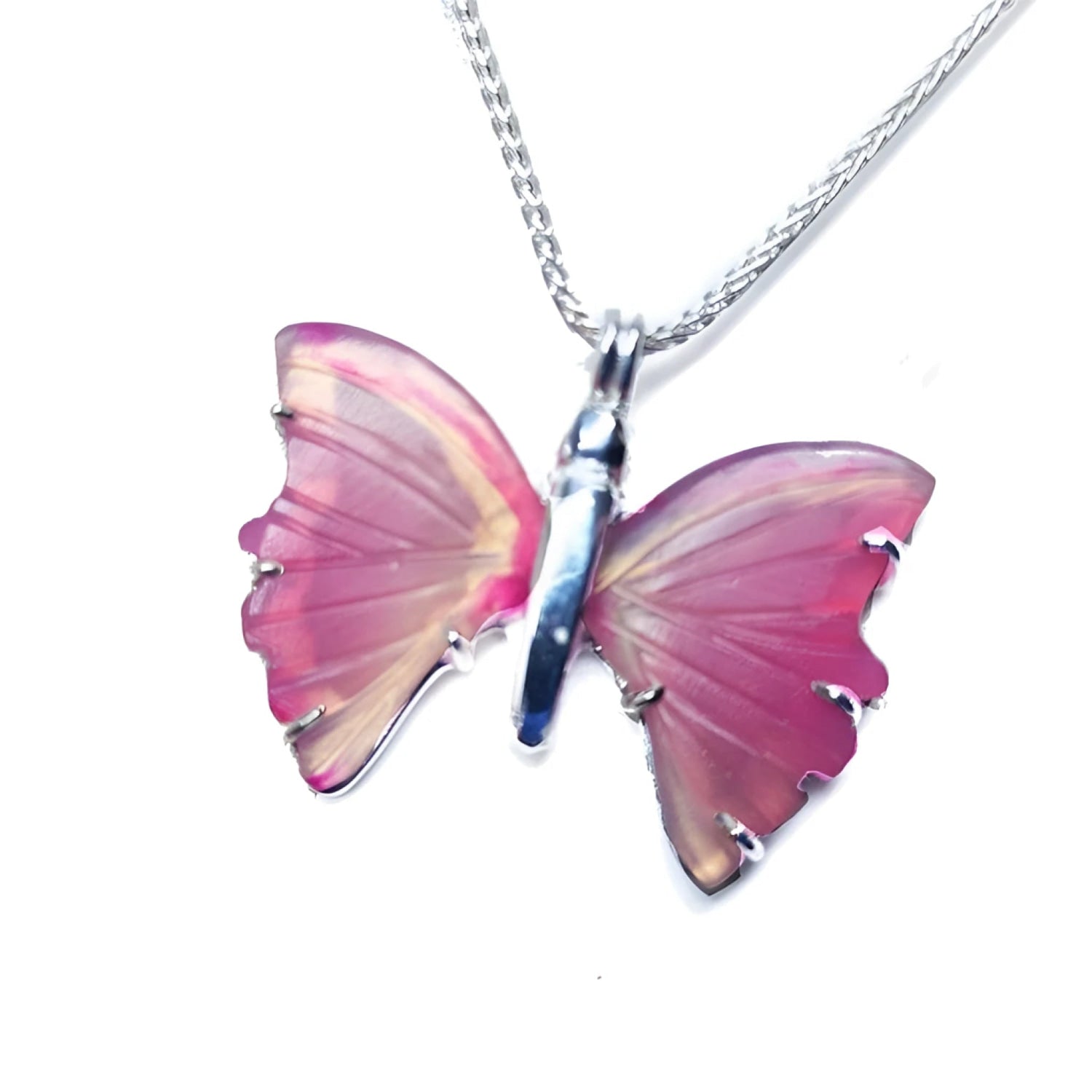 Pink natural agate butterfly pendant with carved wings on a sterling silver necklace.