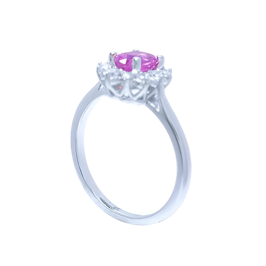 14K white gold ring with oval pink sapphire and diamond halo.