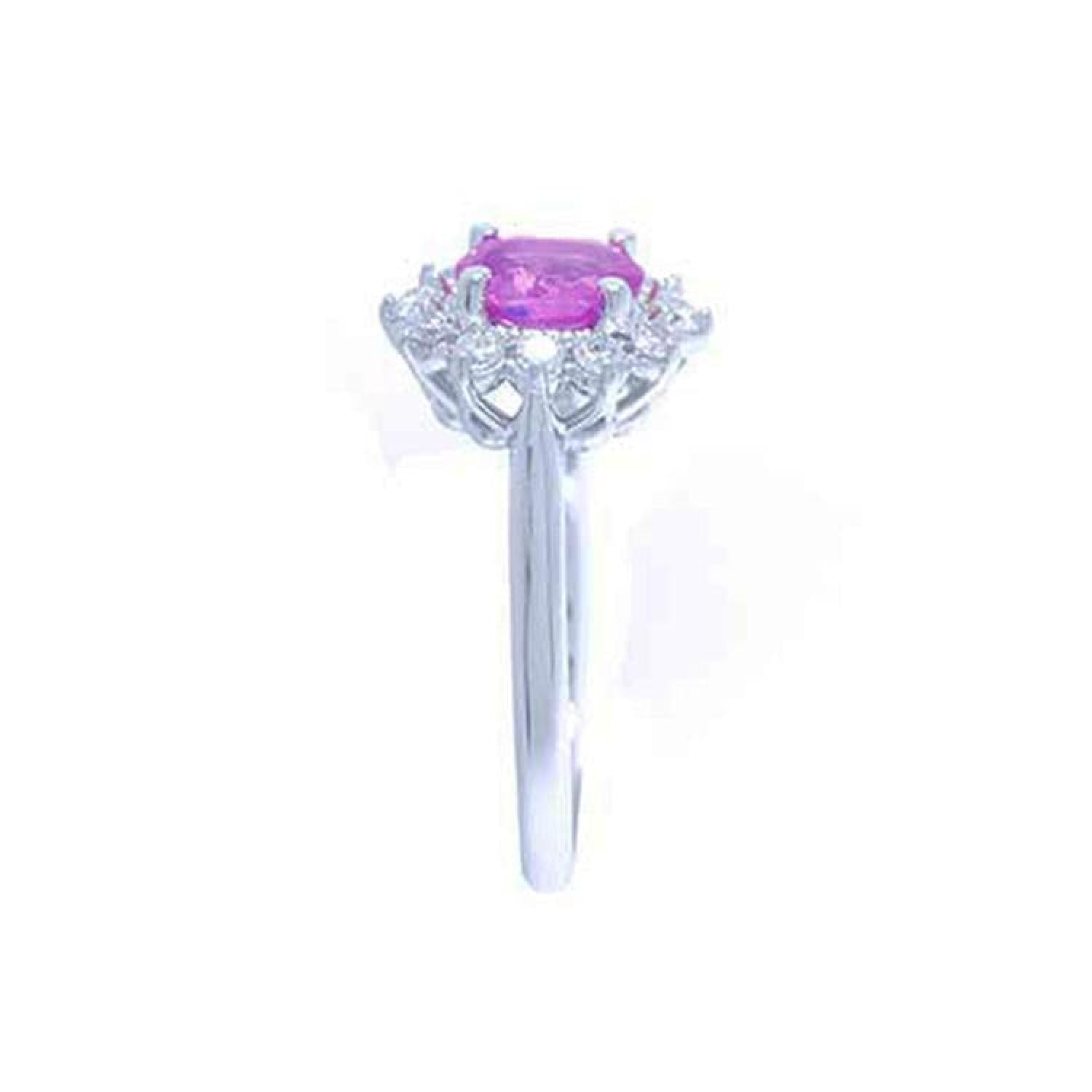 14K white gold ring with oval pink sapphire and diamond halo.