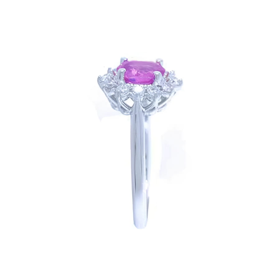 14K white gold ring with oval pink sapphire and diamond halo.