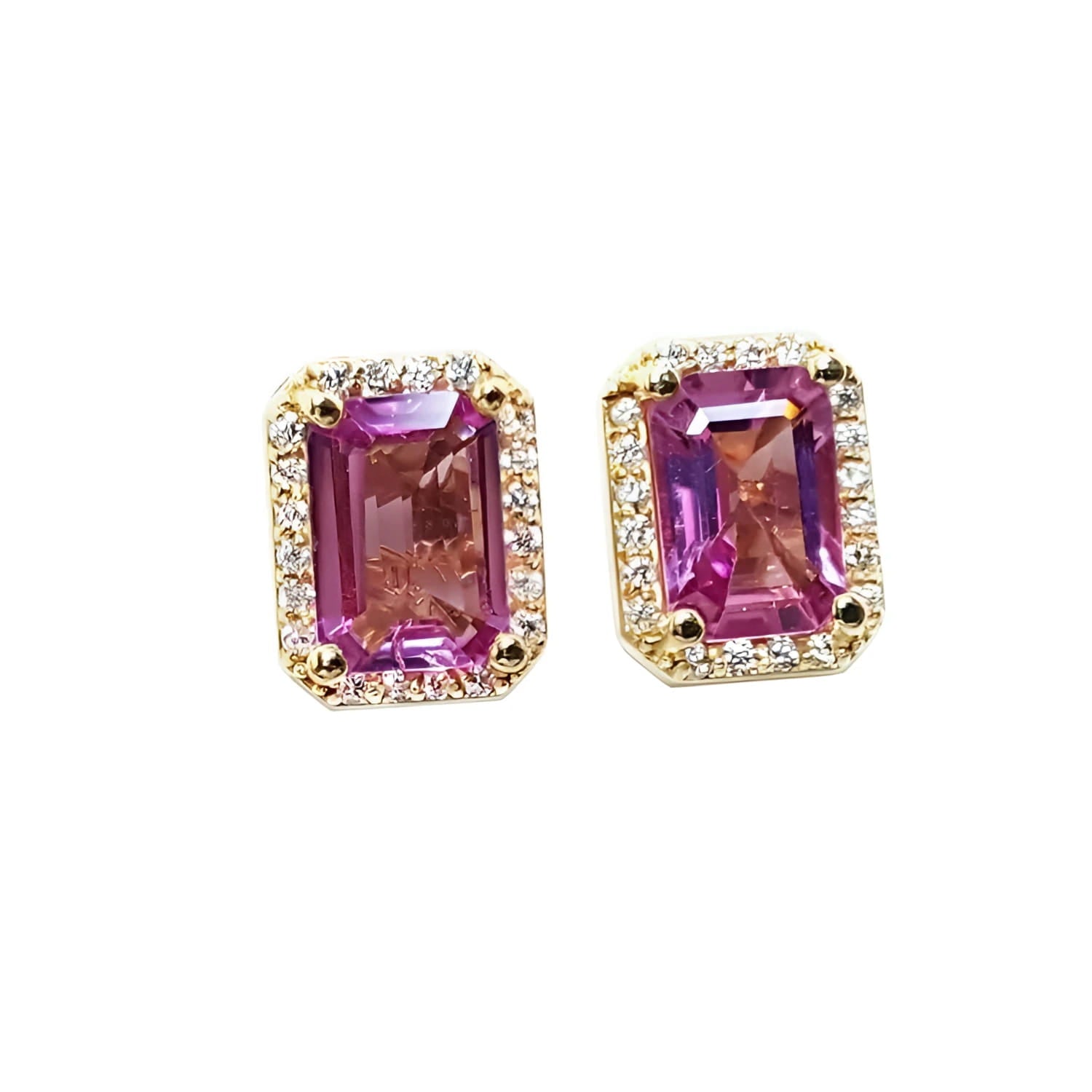 Natural pink sapphire stud earrings halo diamonds crafted in 14k yellow gold.