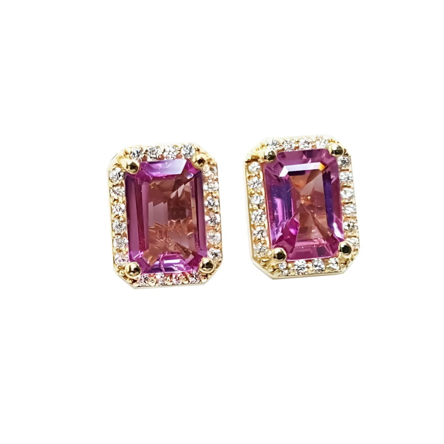 Natural pink sapphire stud earrings halo diamonds crafted in 14k yellow gold.