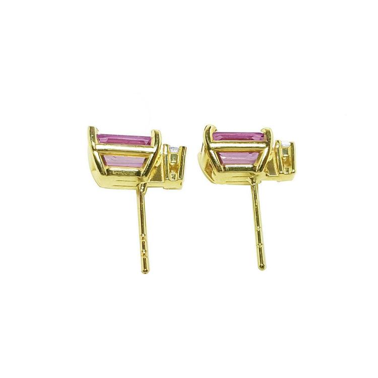 Rectangular emerald cut pink sapphire stud earrings with diamonds in 14K yellow gold.