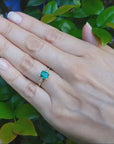 Emerald and accent baguette diamond ring