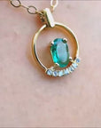 14k yellow gold emerald pendant necklace for women.