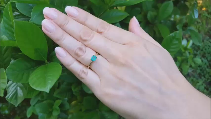 Minimalist emerald solitaire ring May's birthstone in yellow gold