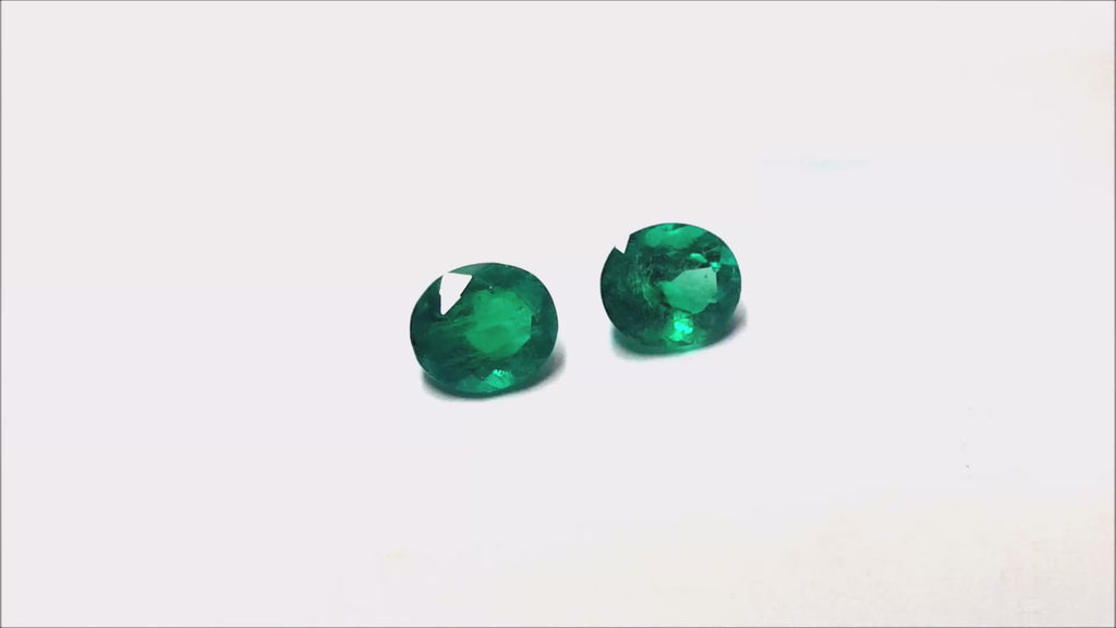 Matched pair oval cut loose emeralds