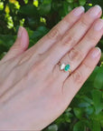 Natural marquise emerald and diamond you and me ring made of 18k yellow gold.