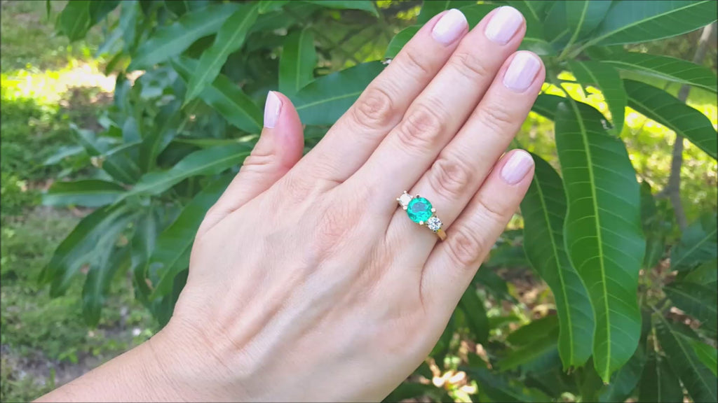 Round cut three stone emerald ring for women
