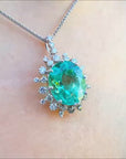 Oval natural emerald pendant halo diamond white gold
