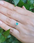 This affordable emerald ring is made of yellow gold.
