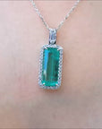 natural colombian emerald pendant with halo diamonds