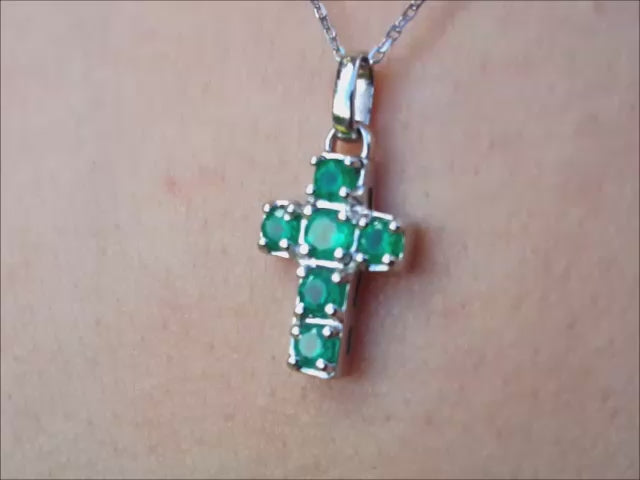 Natural colombian emerald cross pendant necklace crafted in 14k white gold.