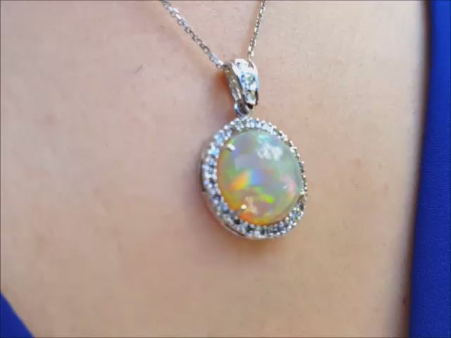 Welo Ethiopian opal pendant with a halo diamond in 14k white gold.