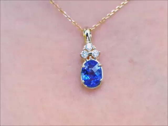 Natural tanzanite and diamond gold pendant for women.