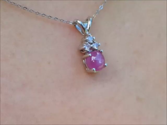 Pink sapphire cabochon pendant necklace with diamonds in a4k white gold.