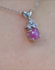 Pink sapphire cabochon pendant necklace with diamonds in a4k white gold.