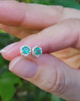 Halo emerald stud earrings