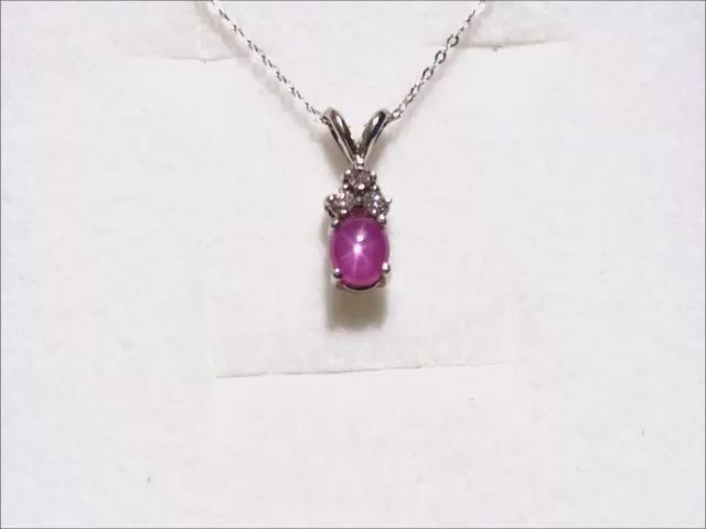 Star pink sapphire pendant necklace for ladies in 14k white gold.