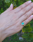 Emerald halo diamond ring yellow gold
