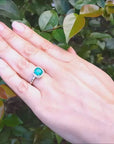 Emerald cushion cut halo diamond ring