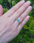 Inexpensive three stone emerald ring