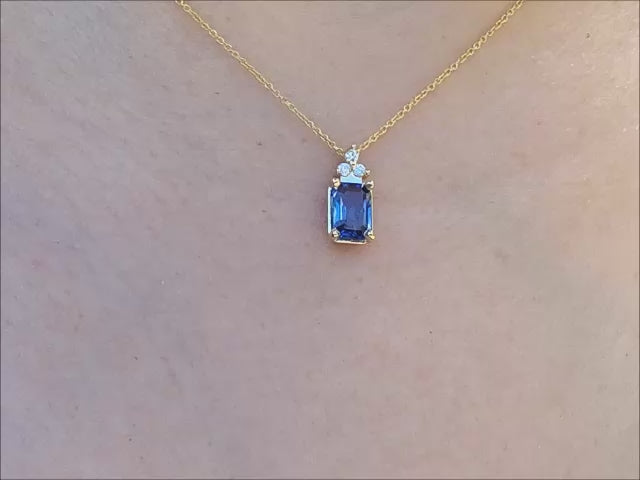 Natural blue sapphire pendant necklace crafted in 14 yellow gold.