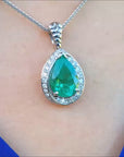 Teardrop natural colombian emerald pendant in white gold