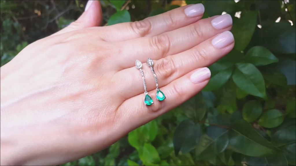 Pear shaped emerald dangle earrings