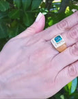 18k yellow gold ring for men with a natural colombian emerald and princess cut diamonds.