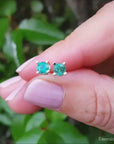 natural colombian emerald stud earrings made of 14k gold.