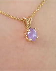 Natural cabochon pink sapphire pendant necklace made of 14k yellow gold.