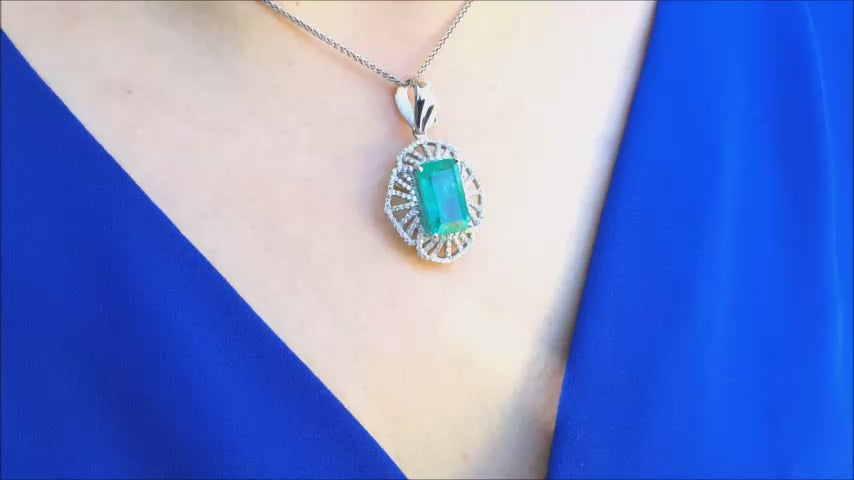 Natural emerald pendant rectangular emerald cut white gold.