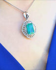 Natural emerald pendant rectangular emerald cut white gold.