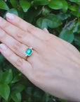 Bezel set solitaire emerald ring