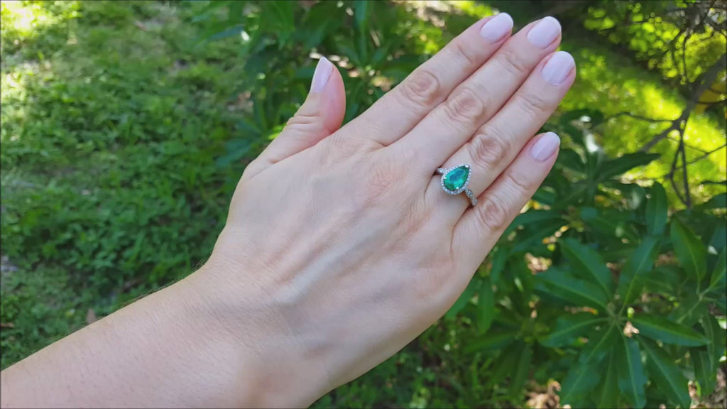 Pear cut halo diamond emerald engagement ring