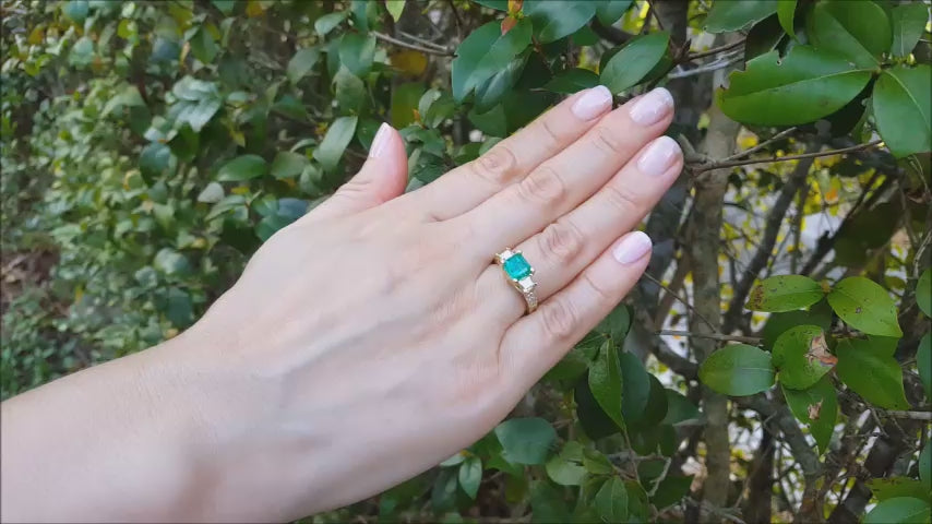 Emerald and princess cut diamond ring