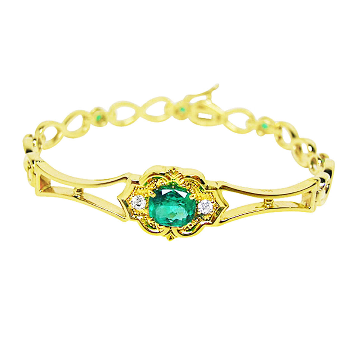 Gold bracelet with a Muzo mine natural emerald oval cut on a white background.