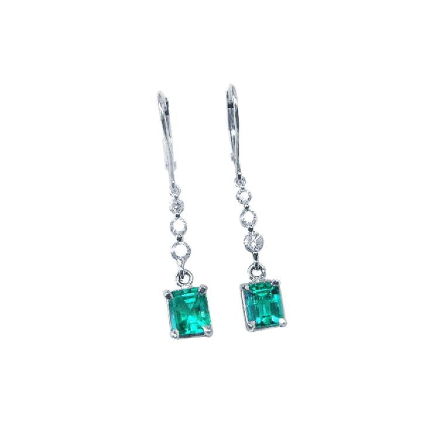 14K white gold dangle earrings with square Colombian emeralds and diamond accents.