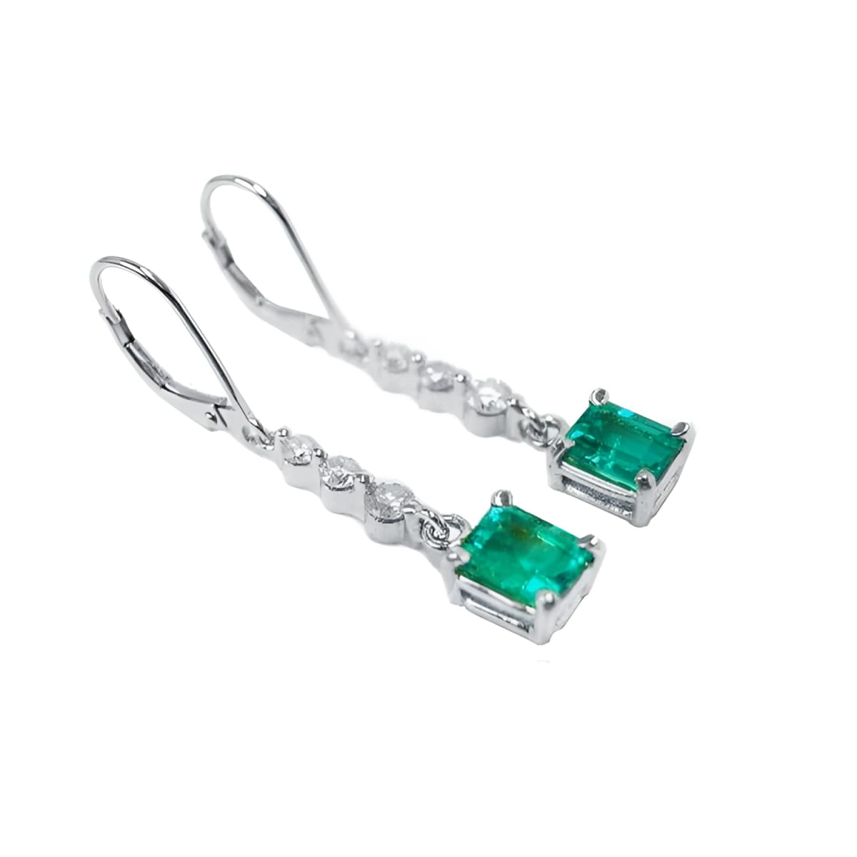 Pair of natural colombian emerald dangle earrings, made of 14k white gold. 
