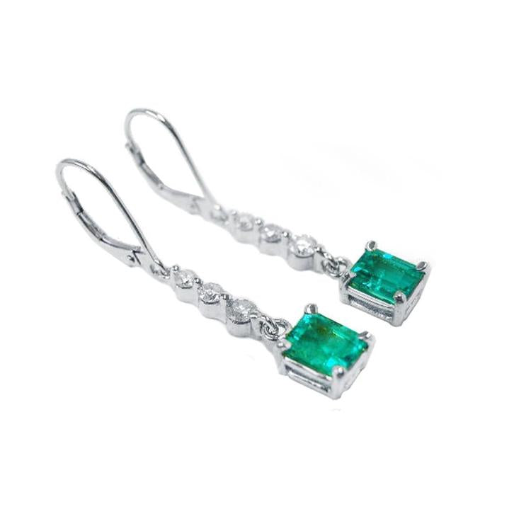 Pair of natural colombian emerald dangle earrings, made of 14k white gold. 