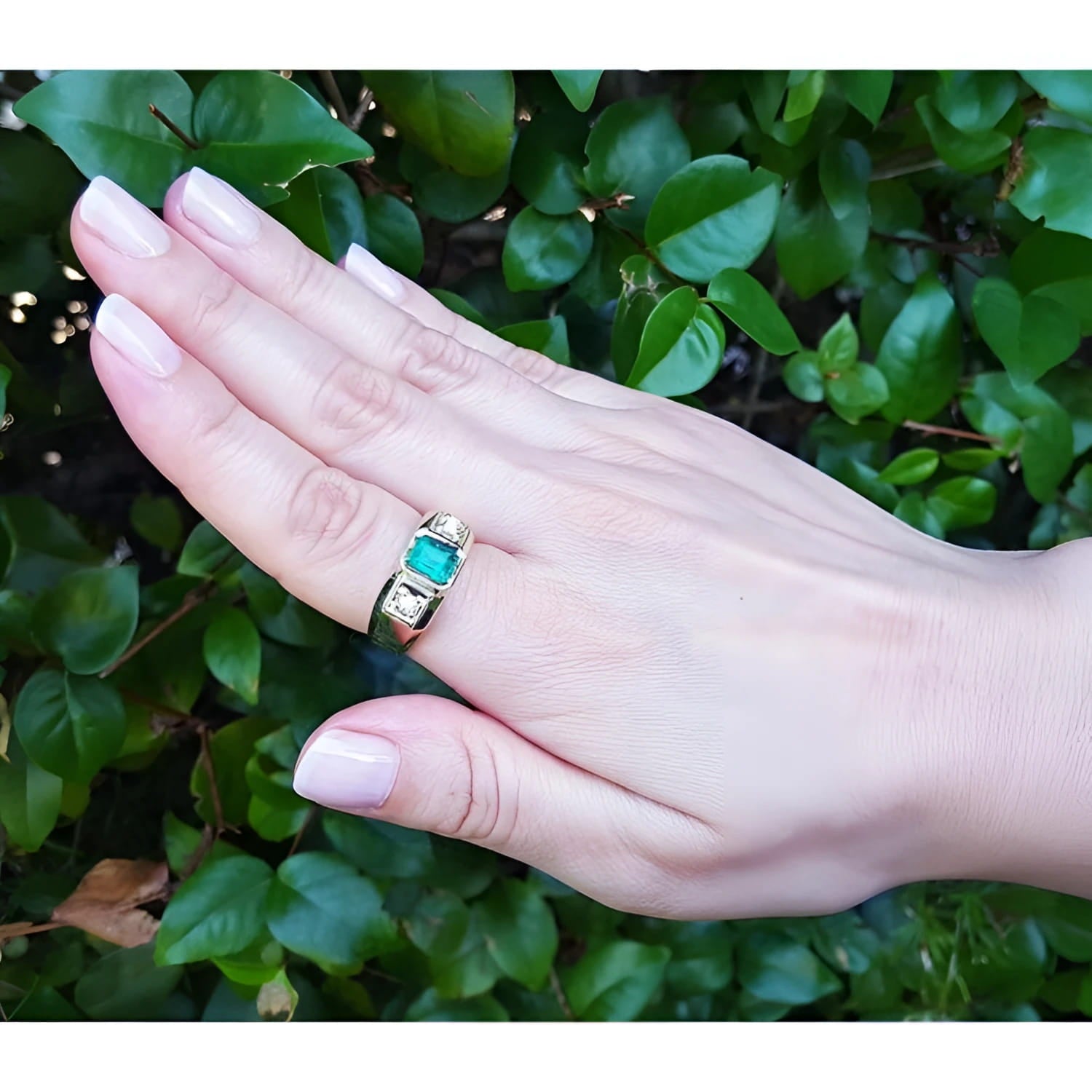 Men's 18K yellow gold ring with a medium bluish-green emerald and two accent diamonds.