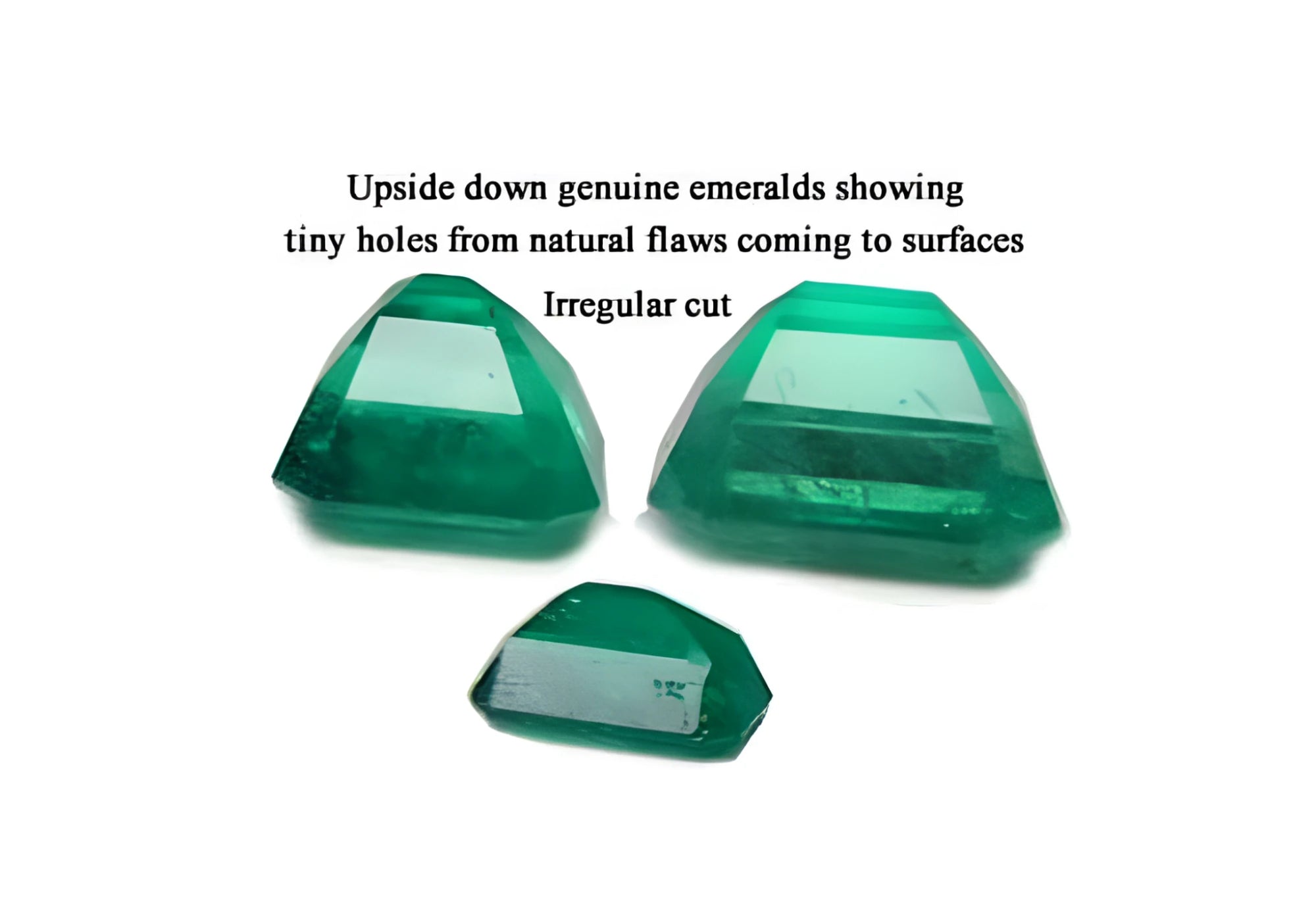 Irregular cut and surface reaching pores in the pavilion of natural emeralds is normal to preserve color, three stones upside down with tags.