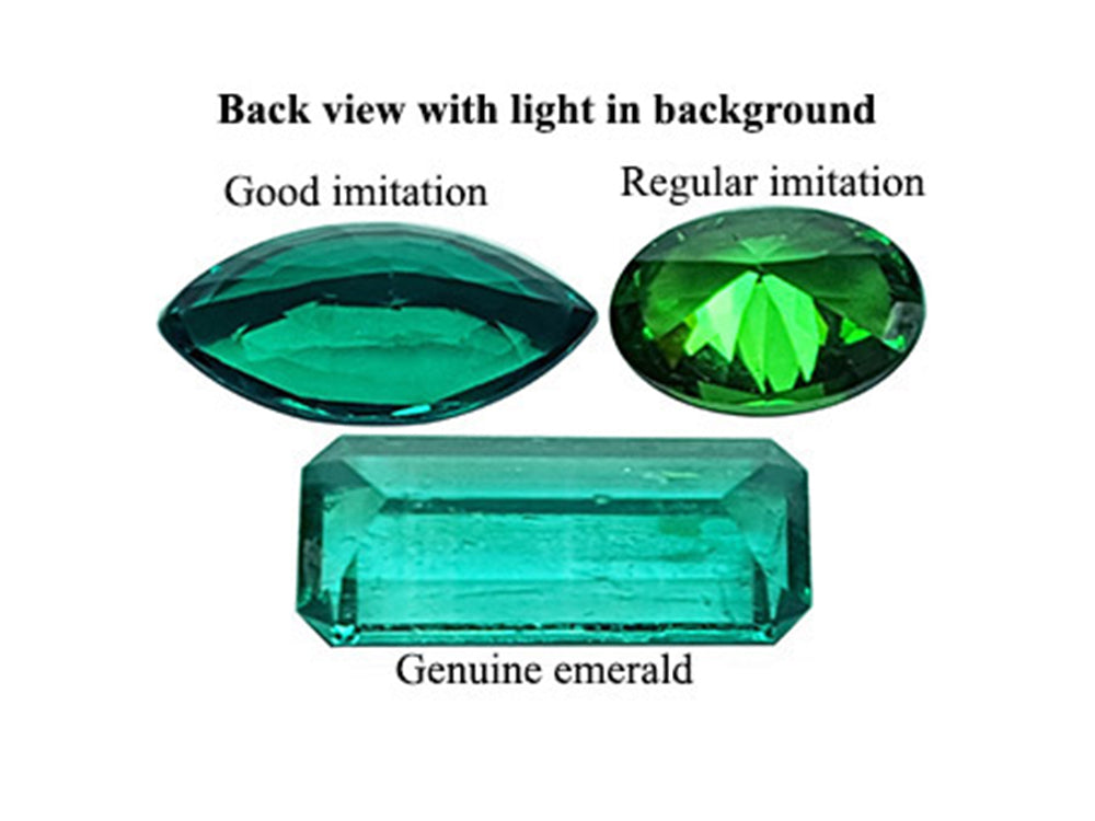 Real emeralds and man-made emeralds:  This photo of three upside-down stones shows more clearly the difference in their natural or fake texture.
