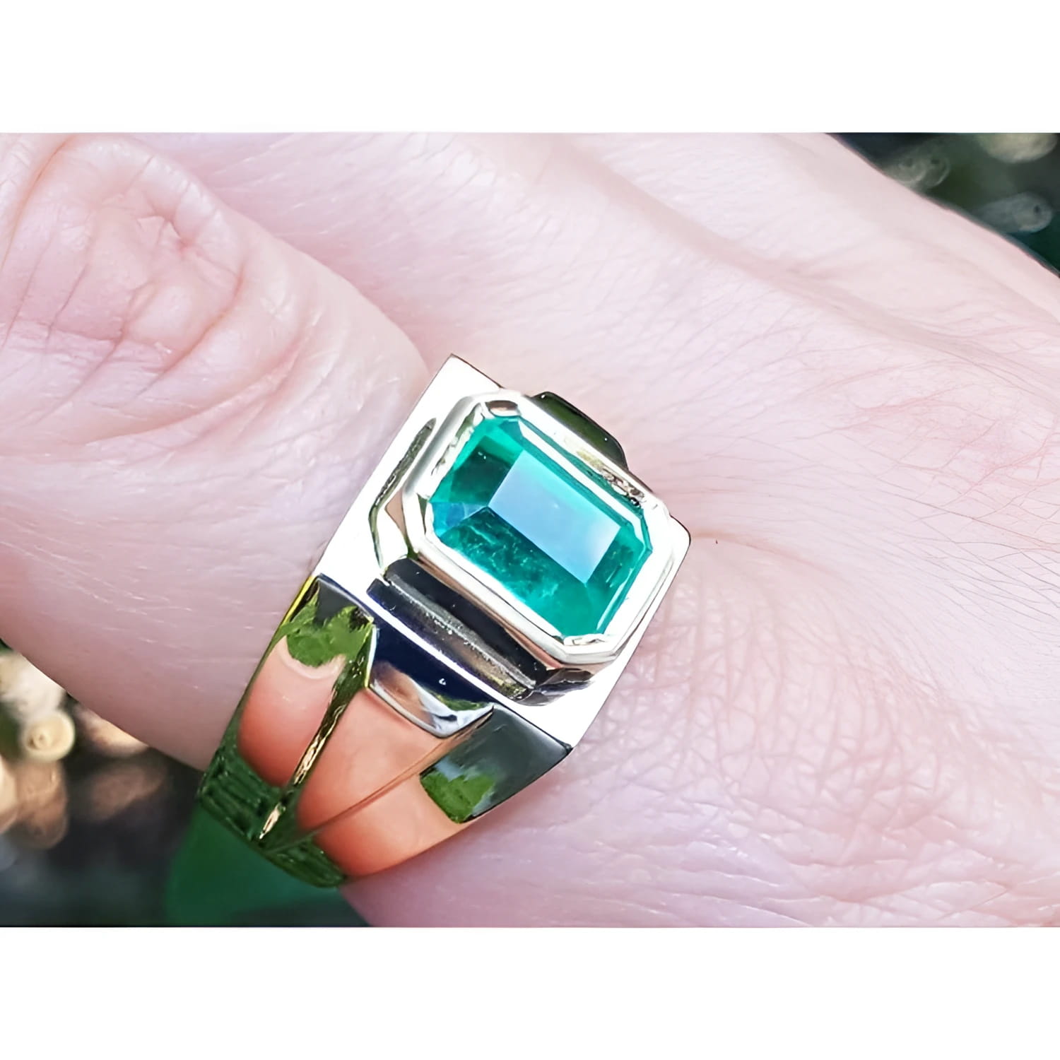Men's 18K yellow gold ring with a rectangular 3.48 ct Colombian emerald in a full bezel setting.