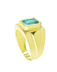 This natural emerald solitaire ring for men made in yellow gold is displaying its half side profile.