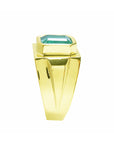 The side profile of this men's emerald solitaire ring displays its topside and profile side of the band design.
