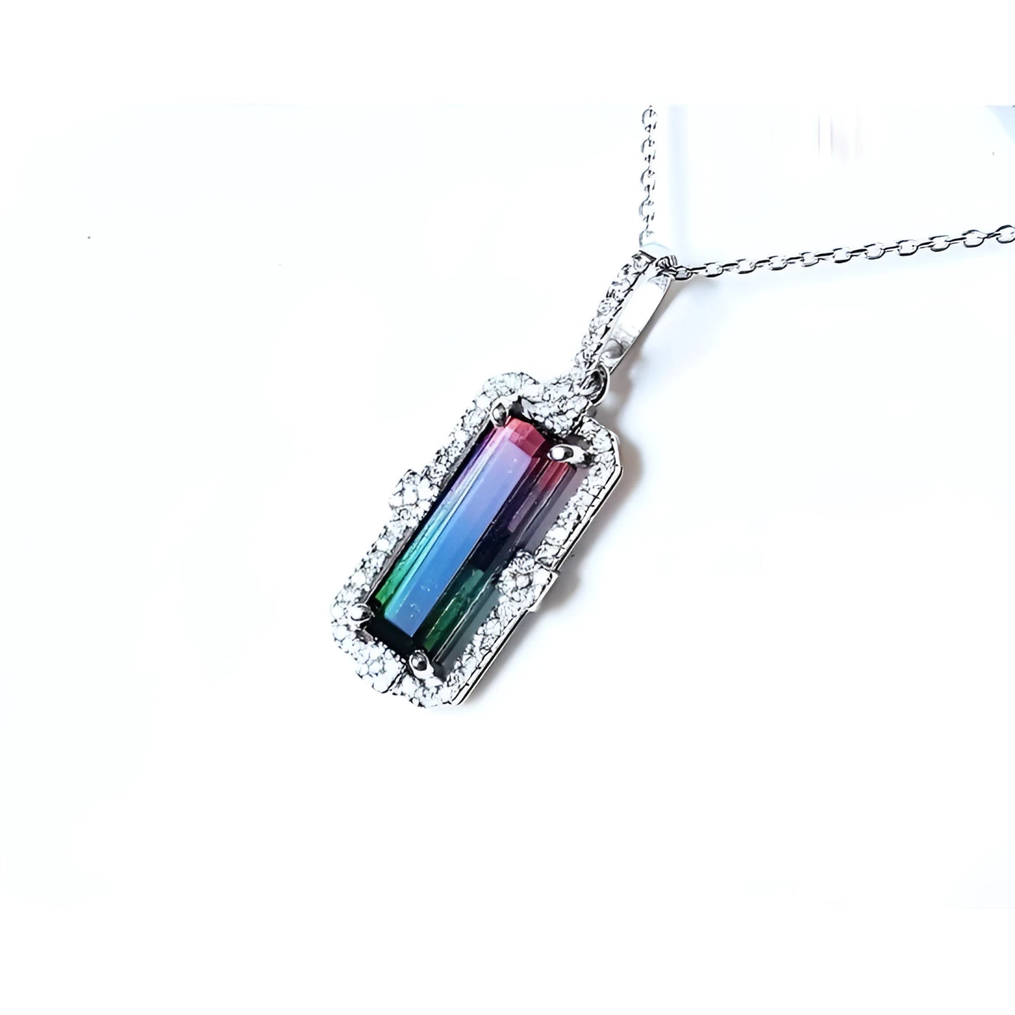 3.50 ct. watermelon tourmaline pendant with diamond halo on an 18K white gold chain.