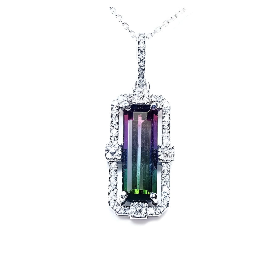 Watermelon tourmaline pendant with diamond halo on an 18K white gold chain.